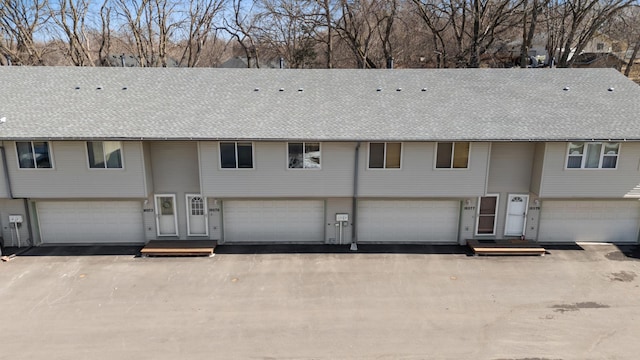 view of front of property with roof with shingles