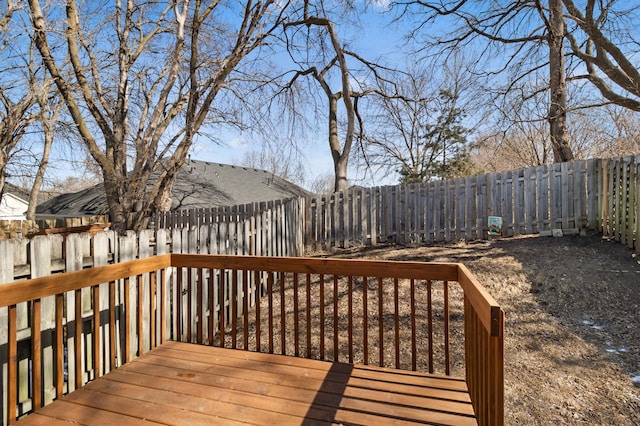 wooden deck featuring a fenced backyard