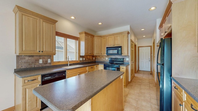 kitchen with dark countertops, backsplash, a kitchen island, black appliances, and a sink