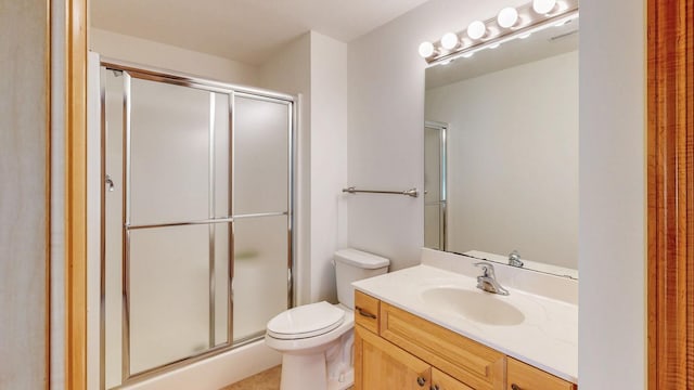 bathroom featuring visible vents, toilet, a stall shower, and vanity