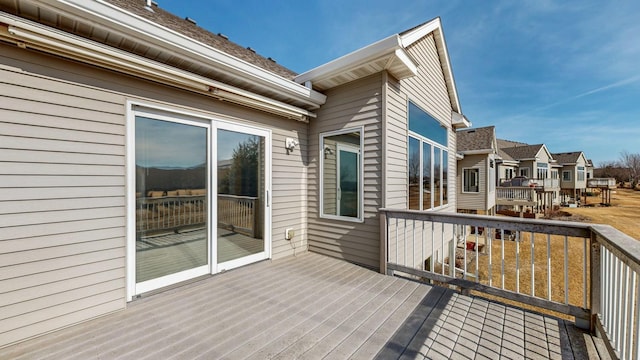 wooden deck featuring a residential view