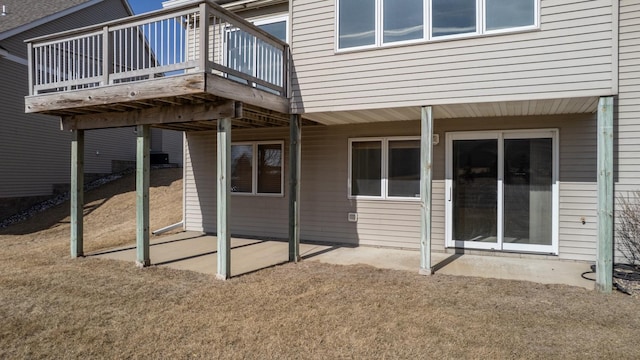 back of property with a patio area and a deck