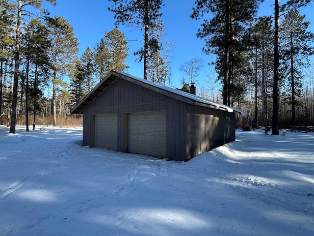 view of snow covered garage