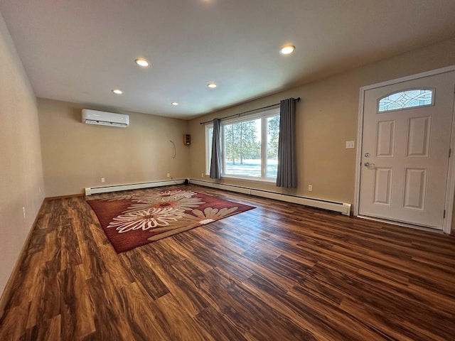 foyer featuring hardwood / wood-style flooring, a wall mounted air conditioner, and baseboard heating