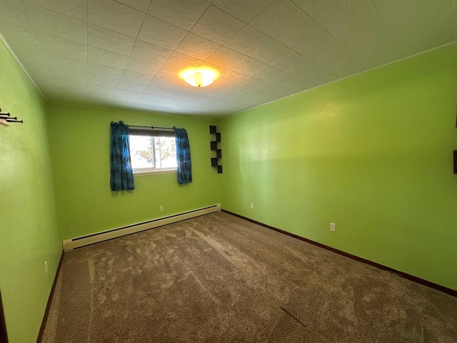 empty room featuring carpet and baseboard heating