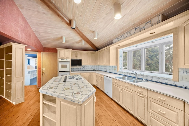 kitchen with sink, white appliances, a kitchen island, decorative backsplash, and vaulted ceiling