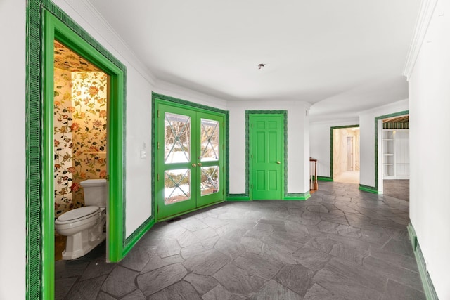 entryway featuring french doors and crown molding