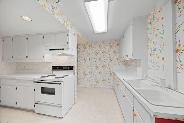 kitchen with white cabinets, sink, and white range with electric stovetop