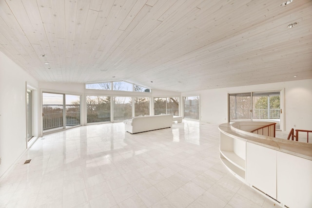 interior space featuring a wealth of natural light, wood ceiling, visible vents, and lofted ceiling