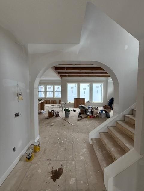 misc room with a towering ceiling