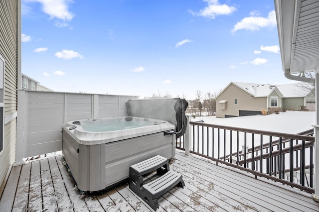 wooden terrace featuring a hot tub