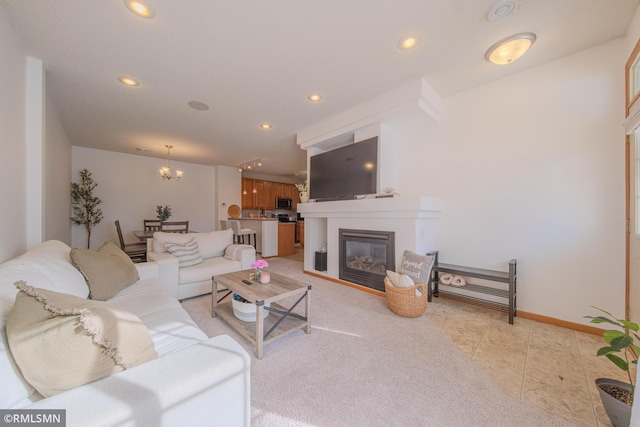 tiled living room featuring an inviting chandelier