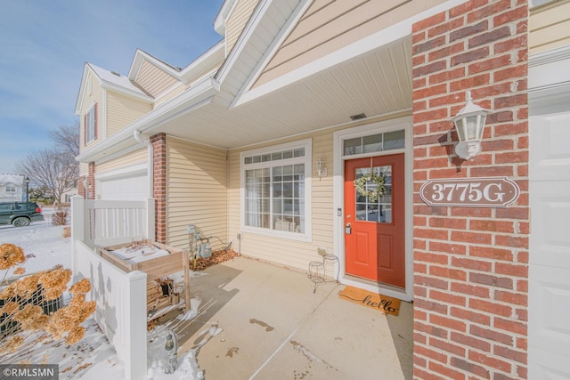 3775 Hazel Trl Unit G, Woodbury, MN 55129 - property entrance featuring brick siding