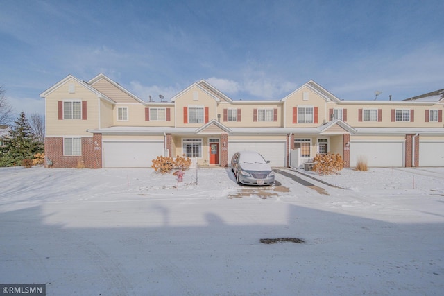 multi unit property featuring a garage