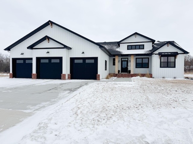 modern farmhouse style home featuring a garage