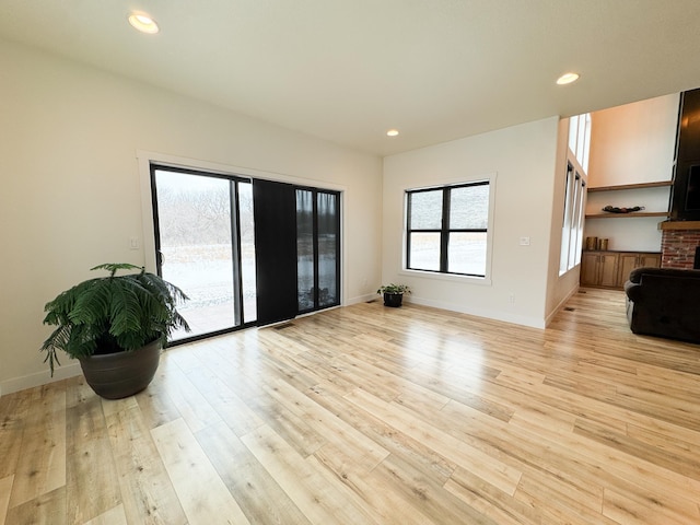 106 19th St NE, Barnesville, MN 56514 - unfurnished living room featuring light wood-style floors and recessed lighting