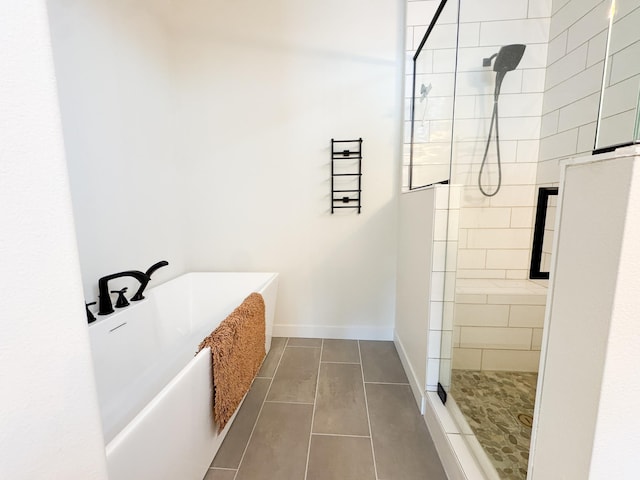 106 19th St NE, Barnesville, MN 56514 - bathroom featuring a freestanding bath, a walk in shower, and tile patterned flooring