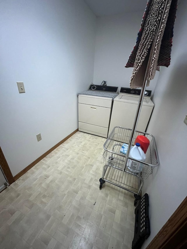 clothes washing area featuring washing machine and clothes dryer