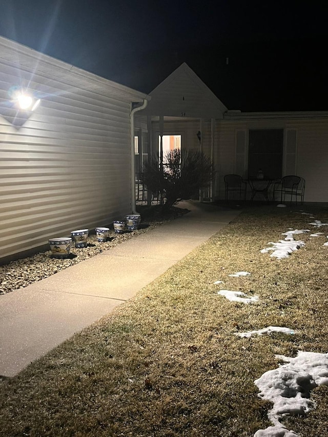 view of yard at twilight