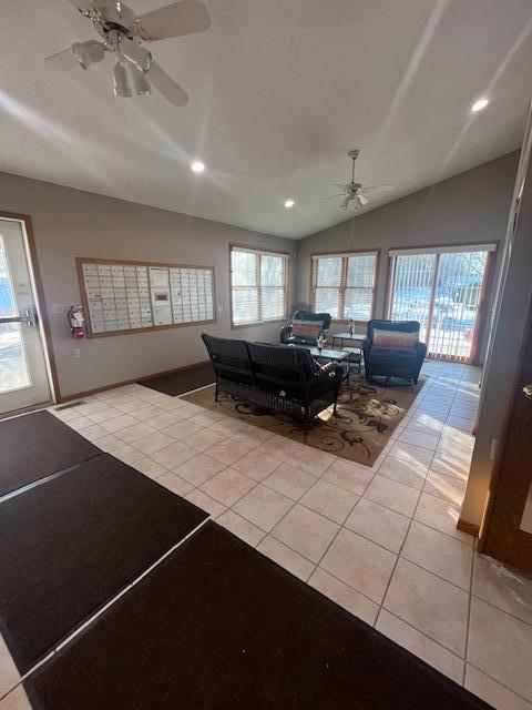 unfurnished living room featuring vaulted ceiling, light tile patterned floors, recessed lighting, and ceiling fan