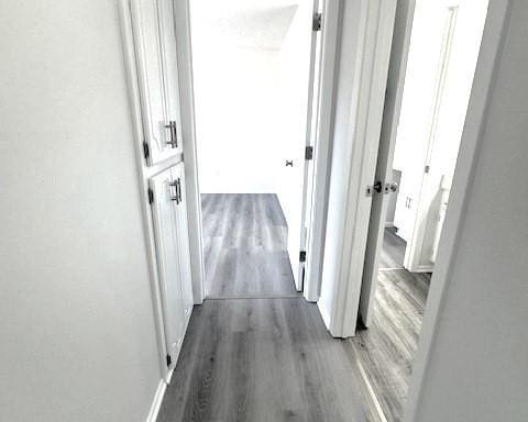 hall with dark hardwood / wood-style floors