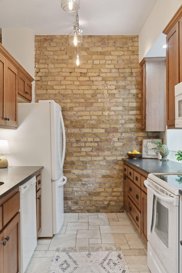 kitchen with white appliances and brick wall