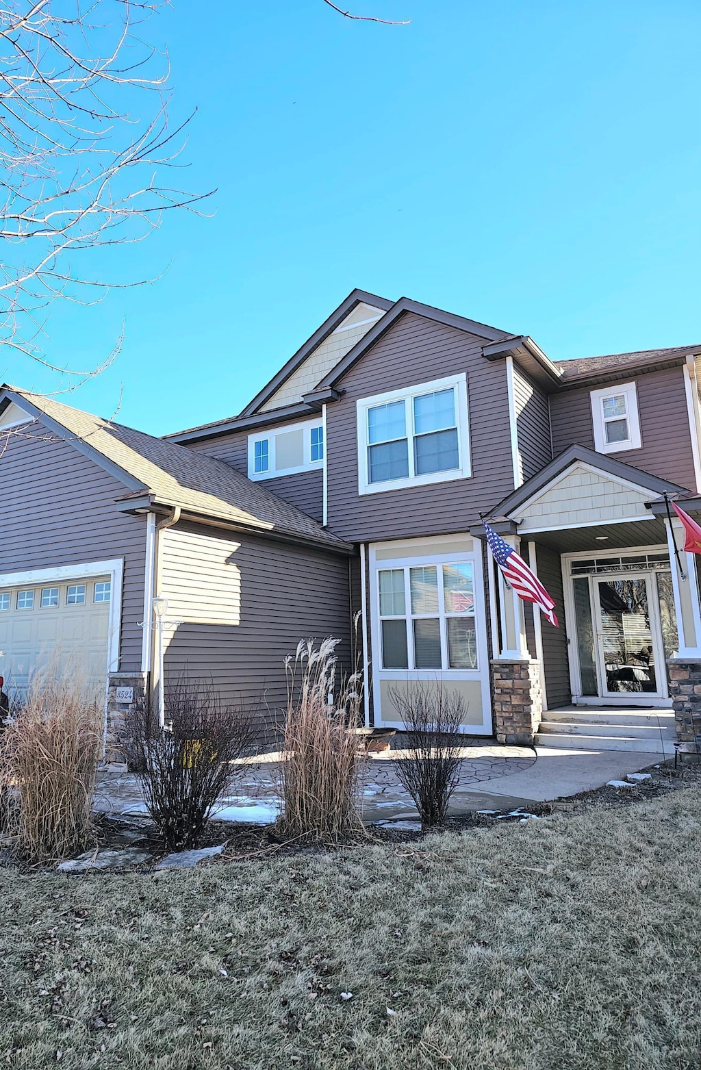 view of front of home with a garage and covered porch