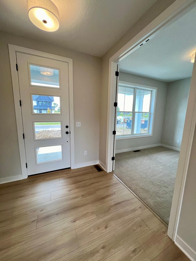 entryway with light wood-type flooring