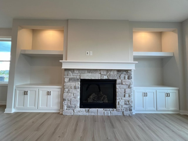 details with wood-type flooring and a fireplace