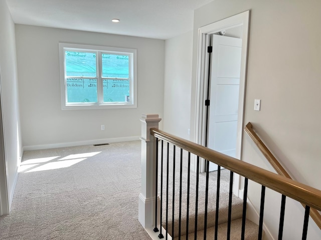 corridor with carpet floors