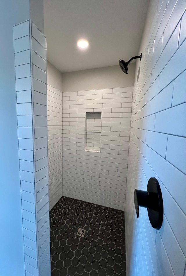 bathroom with a tile shower