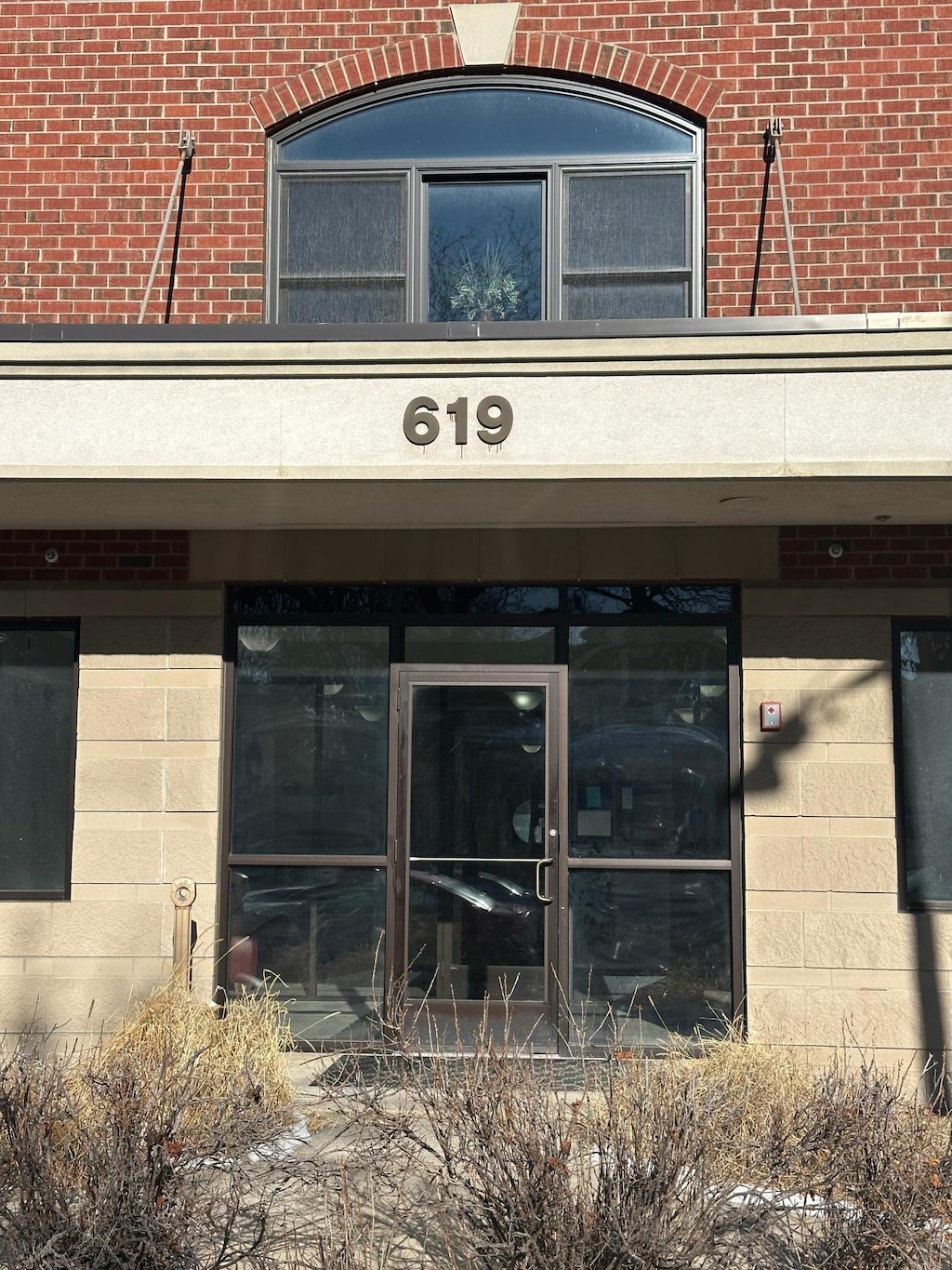 entrance to property with brick siding