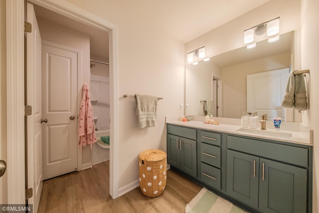 bathroom featuring hardwood / wood-style flooring and vanity