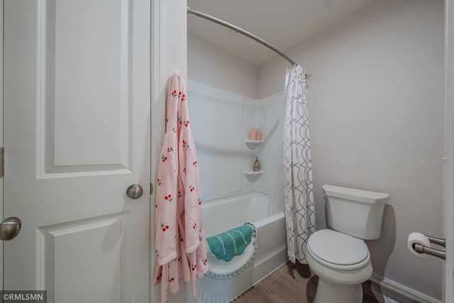 bathroom with shower / tub combo with curtain, wood-type flooring, and toilet