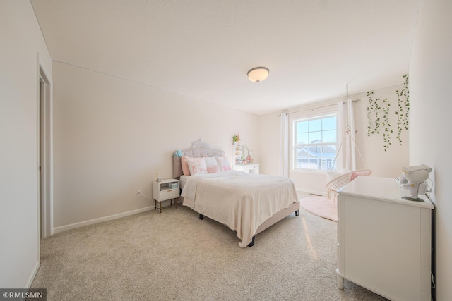 bedroom featuring light carpet