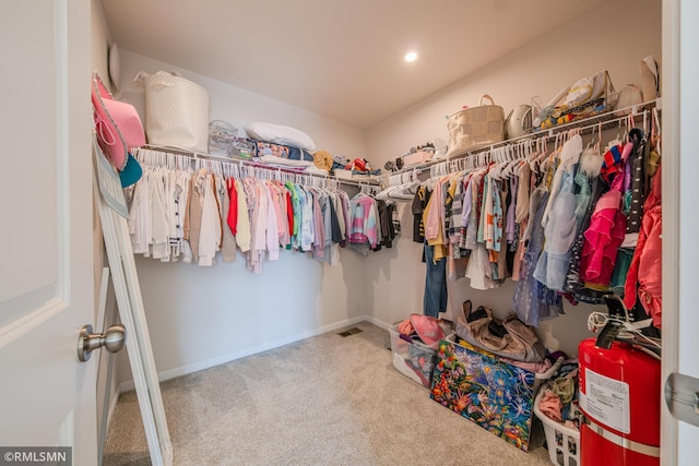 spacious closet featuring carpet floors