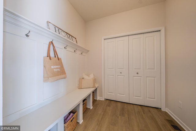 mudroom with hardwood / wood-style flooring