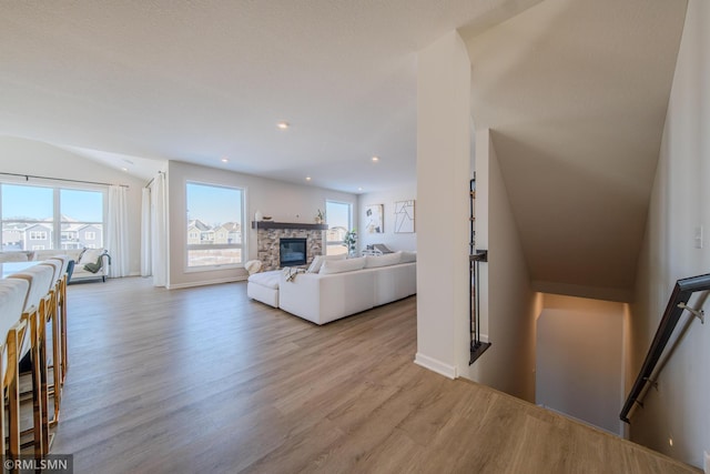 living room featuring a fireplace and light hardwood / wood-style floors