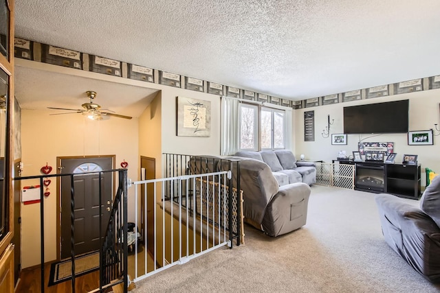 living room with a textured ceiling and carpet