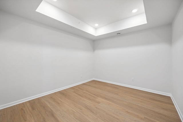 spare room with hardwood / wood-style floors