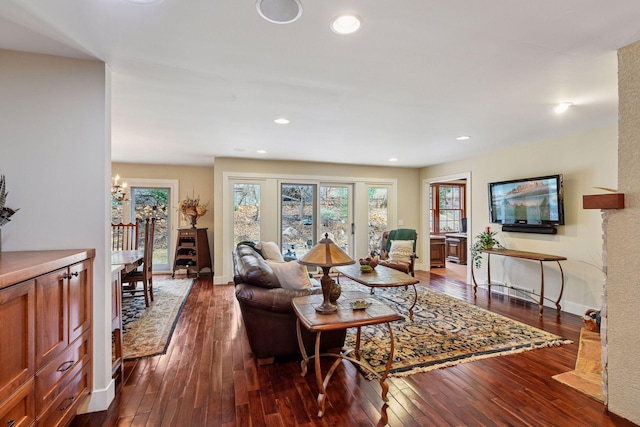 living room with recessed lighting, dark wood-type flooring, and baseboards