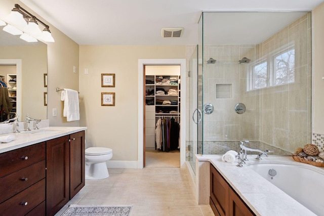 full bathroom featuring visible vents, toilet, a stall shower, a bath, and vanity