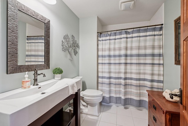 full bathroom with tile patterned flooring, a shower with shower curtain, toilet, and vanity