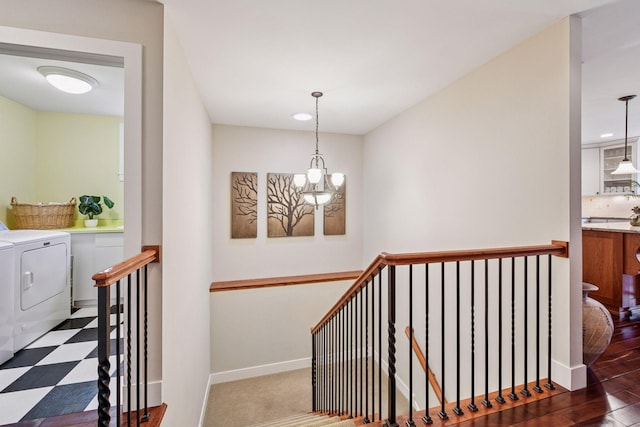 stairs with baseboards, a chandelier, washing machine and dryer, recessed lighting, and tile patterned floors