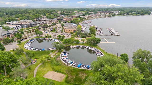 birds eye view of property with a water view