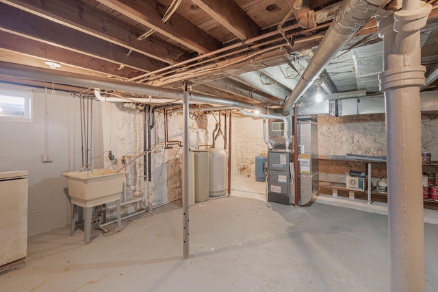 basement with washer / clothes dryer, sink, and heating unit