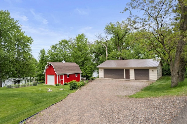 1697 Shore Dr, Arthur Twp, MN 55051 - detached garage featuring view of wooded area