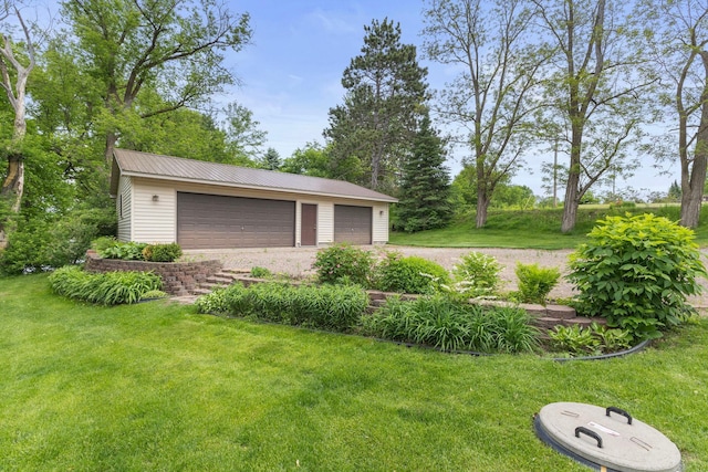 1697 Shore Dr, Arthur Twp, MN 55051 - view of green lawn with an outdoor structure and a garage
