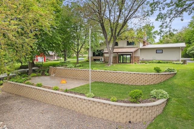 1697 Shore Dr, Arthur Twp, MN 55051 - rear view of property featuring a yard, a chimney, and brick siding
