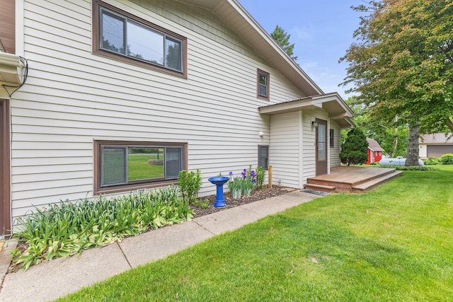 1697 Shore Dr, Arthur Twp, MN 55051 - rear view of house featuring a lawn and a deck